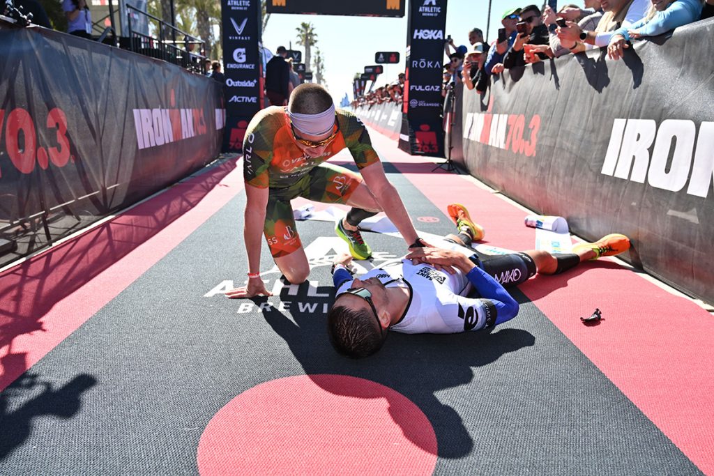Jason West collapses near a lying Léo Bergère after they've both crossed the finish line.